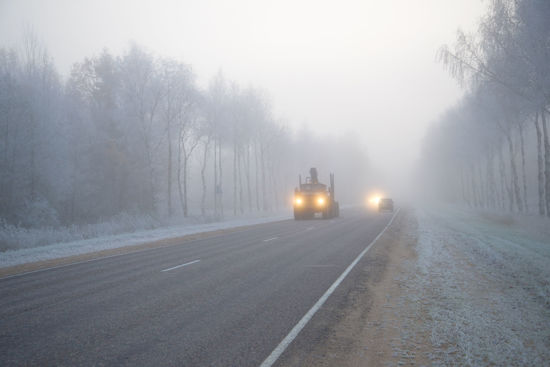 truck driving in foggy weather