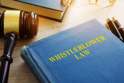 whistleblower law book and gavel