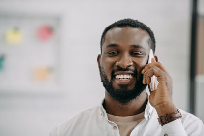 smiling man on phone