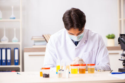 person in lab studying samples