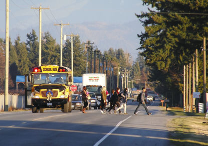 older children getting off bus